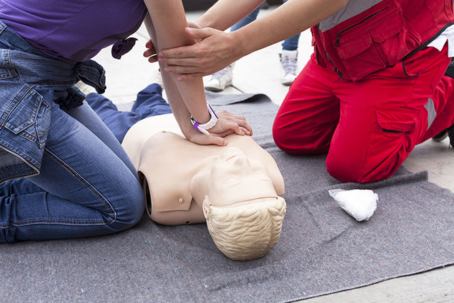 Chest compressions being performed on a resuscitation dummy