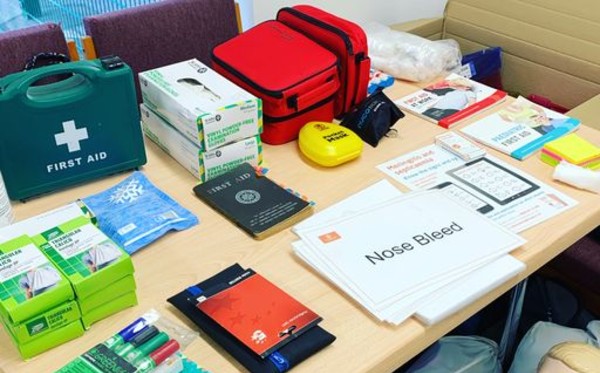 First aid kit and other apparatus laid out on a table